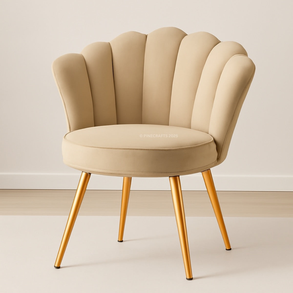 Beige armchair with scalloped backrest and gold legs on a neutral background
